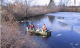 Engineers collect sediment samples from a pond, which were then tested using Sitelab's UVF-3100 analyzer.